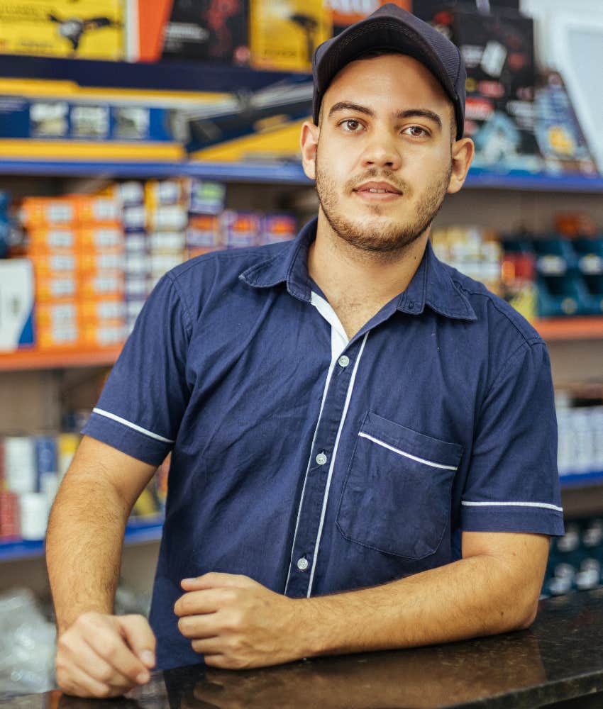 young man working in gas station part time