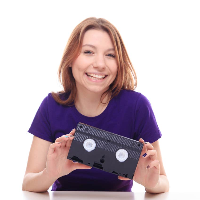 woman holding vhs tape 90s relic making comeback