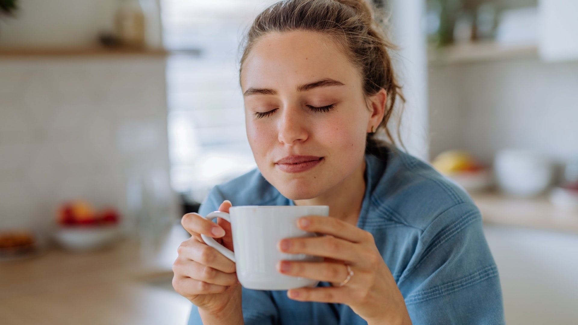 woman enjoying coffee during her morning routine