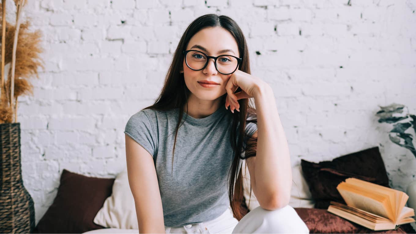 If You Always Sit In The Same Spot At Home, It Probably Means These Things About You smiling content woman sitting in the same spot at home