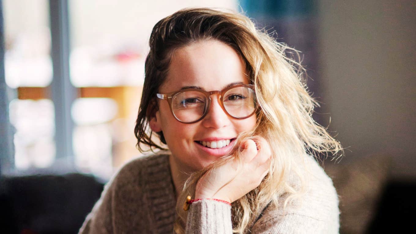 Smiling person showing kindness and warmth, representing the simple habits of naturally nice people