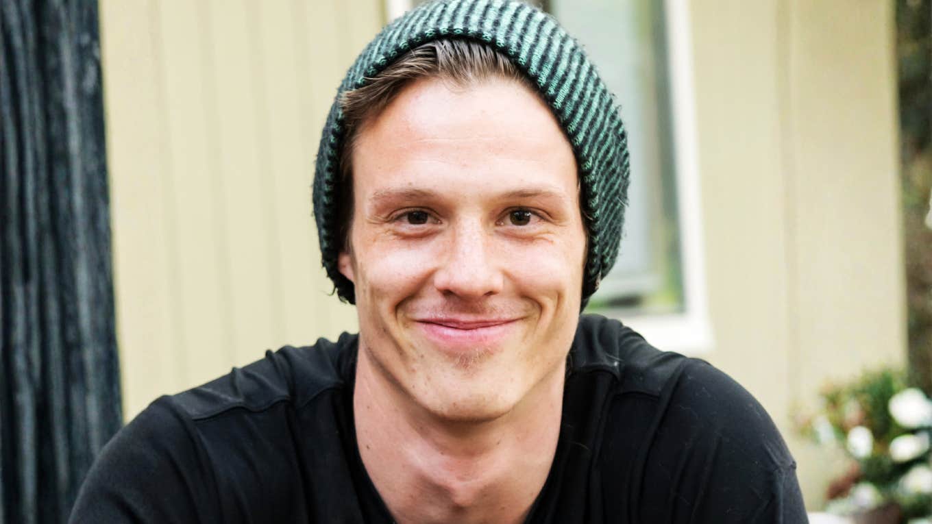 Kind-looking man in a beanie, demonstrating small daily gestures that can positively impact someone’s life