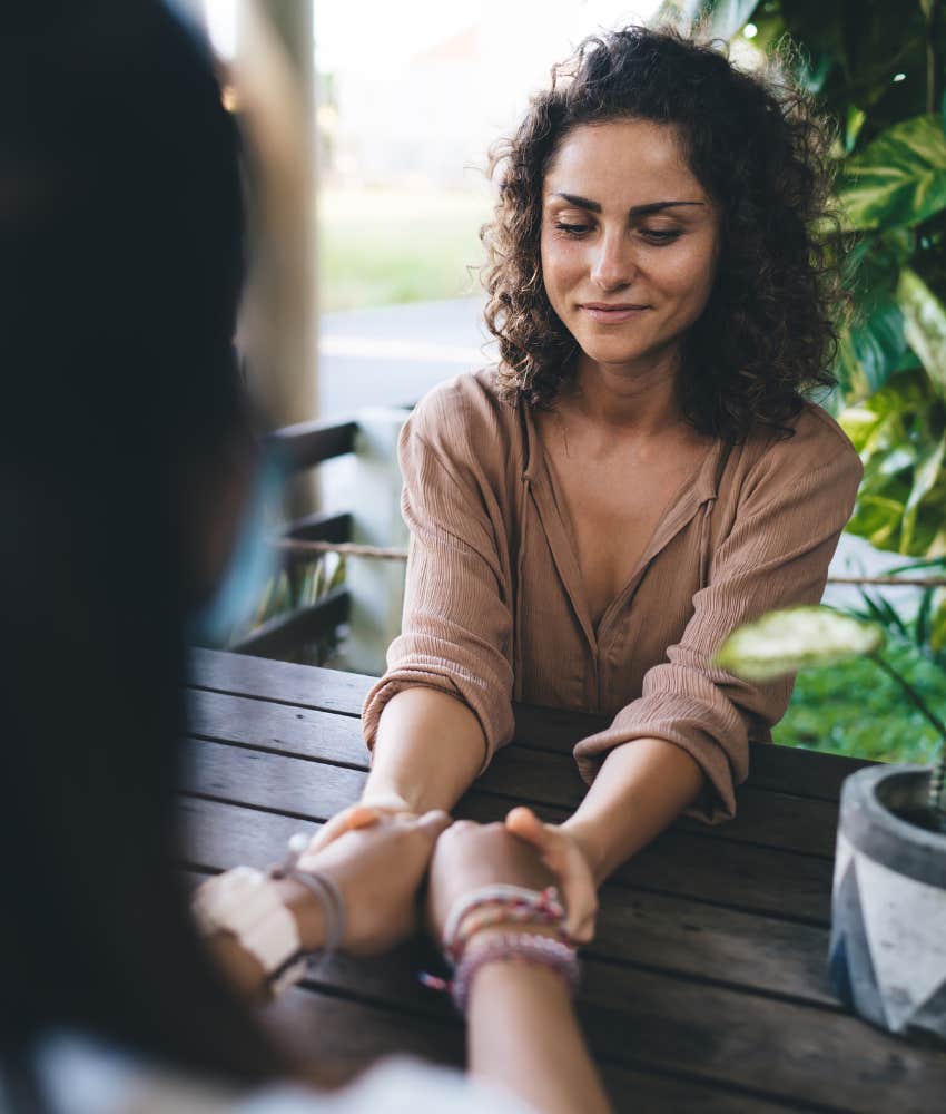 Confident healer works with client