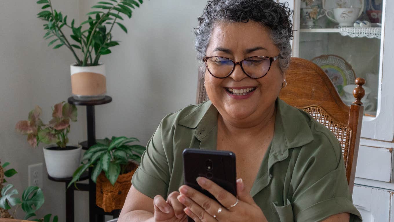 As If Worrying About Your Kids’ Screen Time Wasn’t Enough, Survey Reveals Your Parents’ Is Probably Worse older woman on her phone