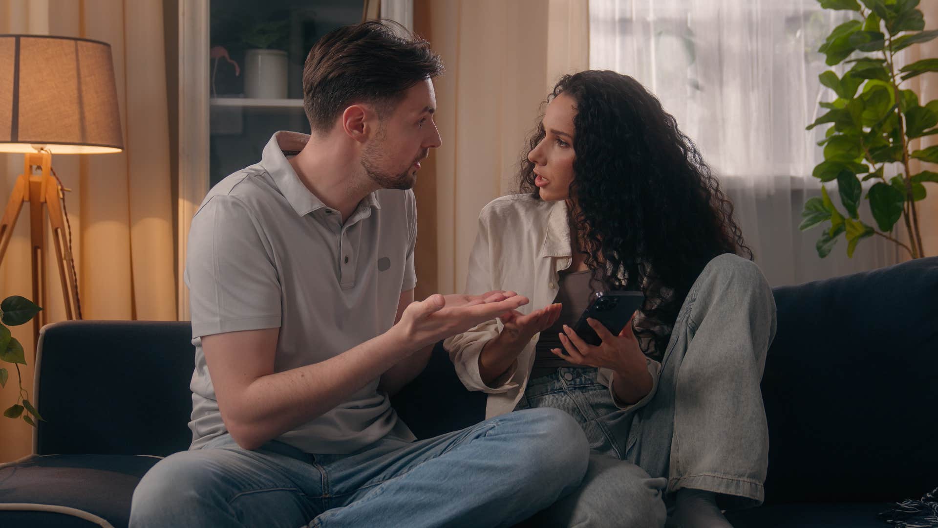 man telling upset woman what to do