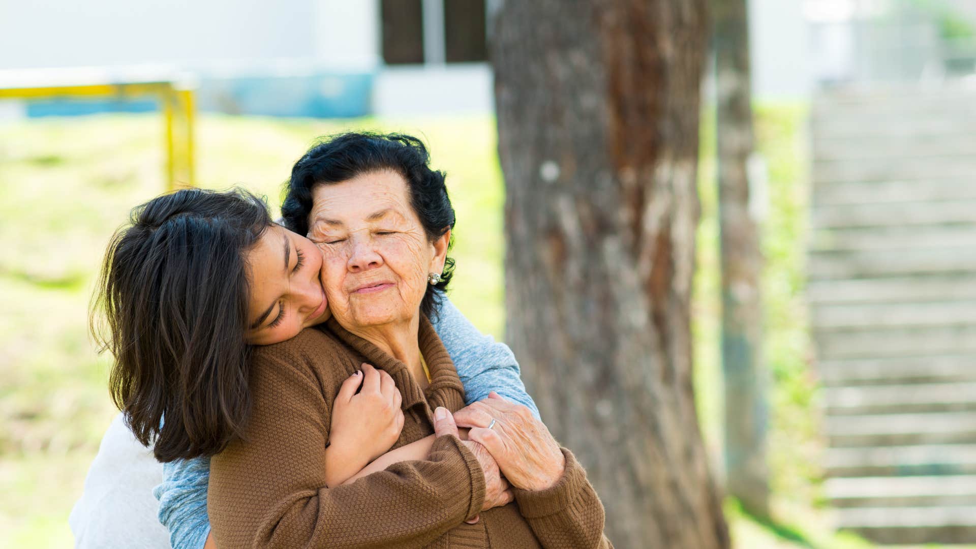 woman kissing mom on the cheek