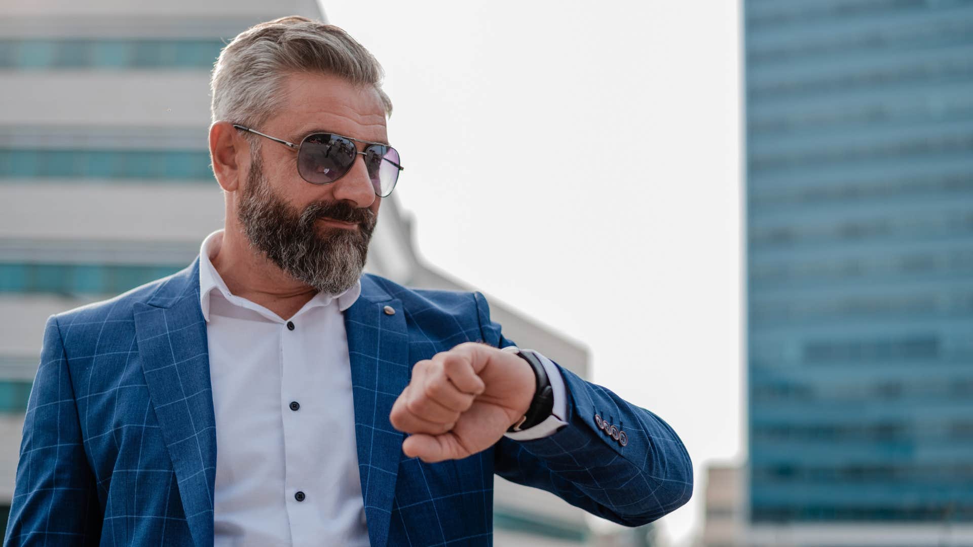 man looking at watch to be on time