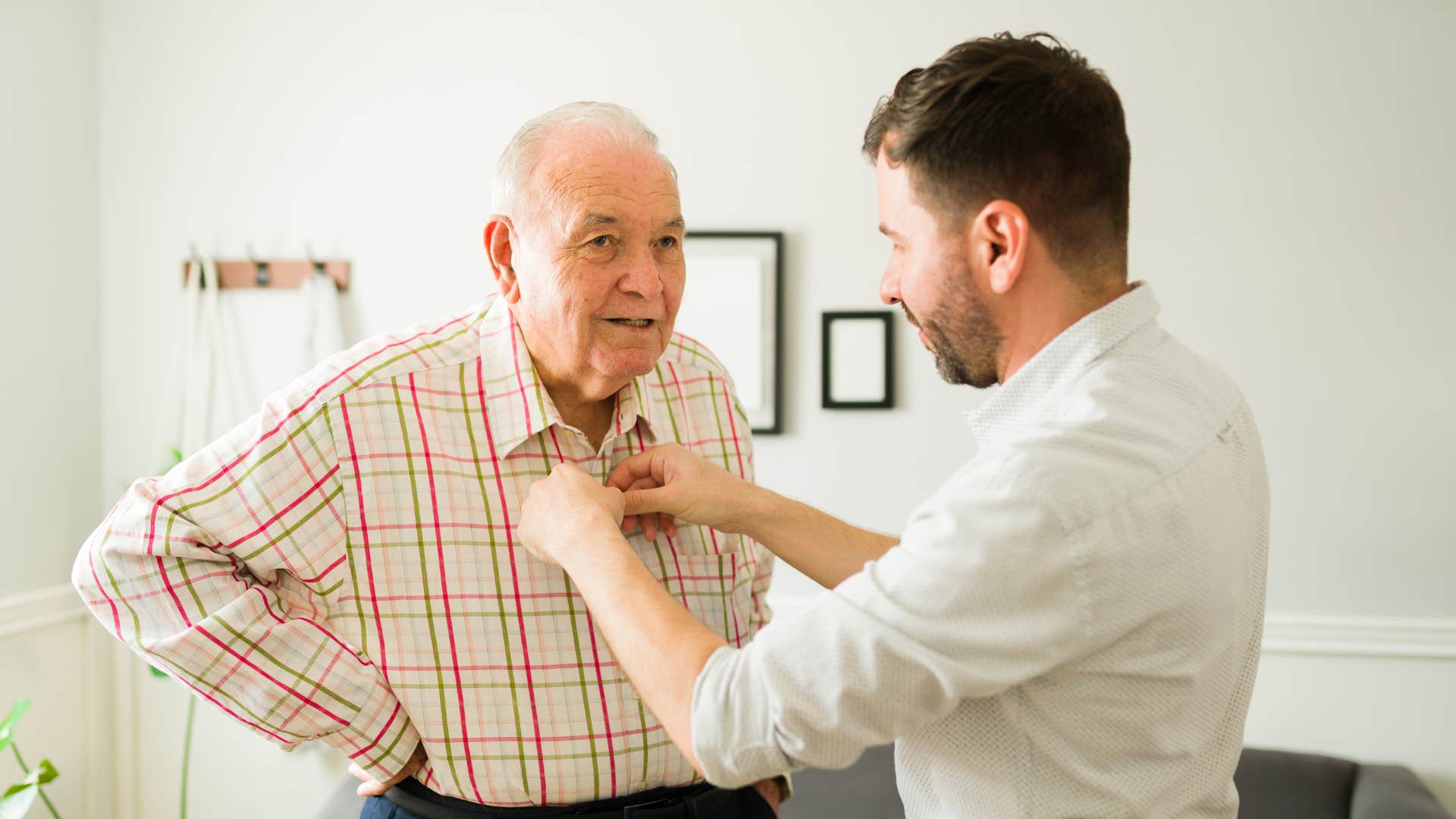 young man fixing his older fathers tie