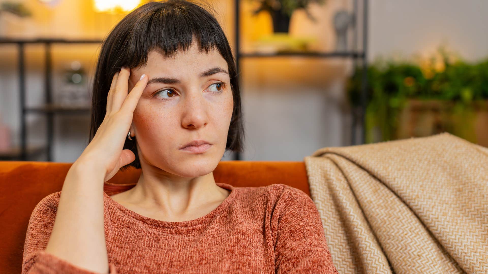 pensive woman keeping her feelings to herself