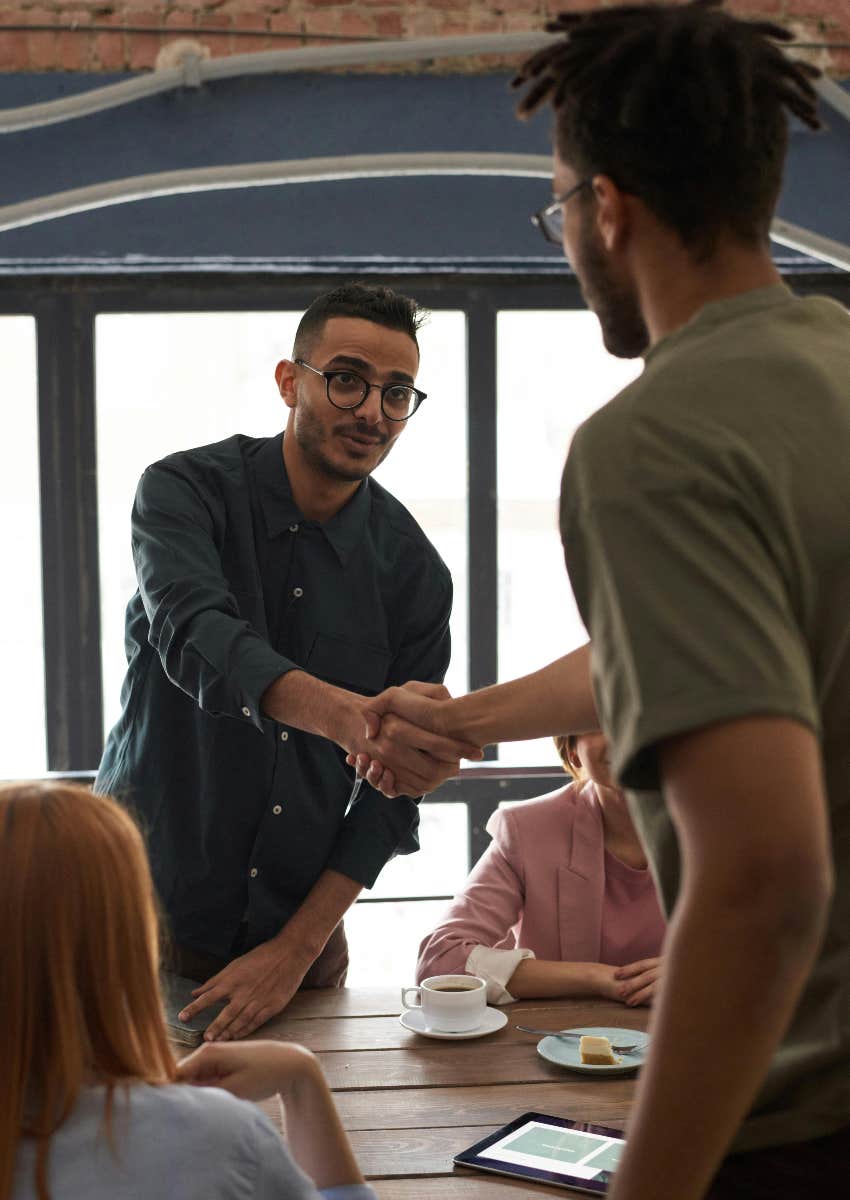 men shaking hands as an act of kindness