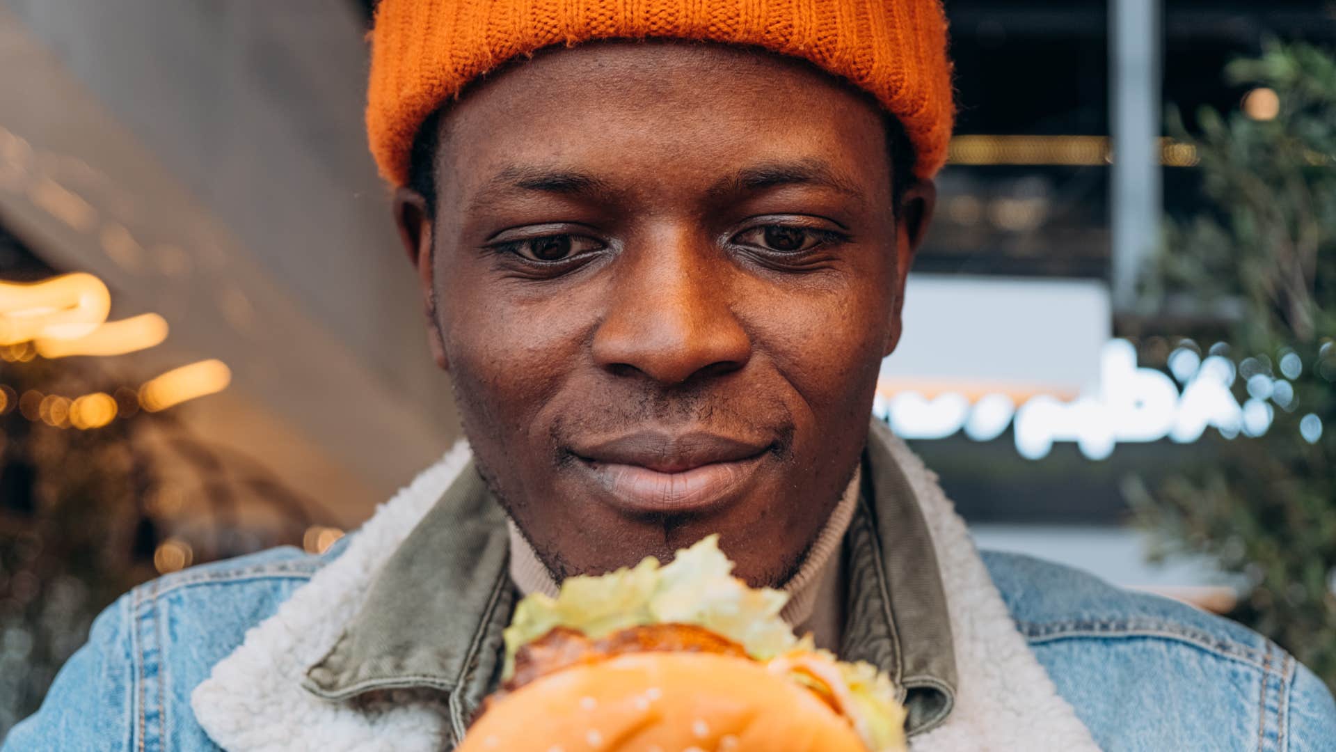 man trying new food smiling