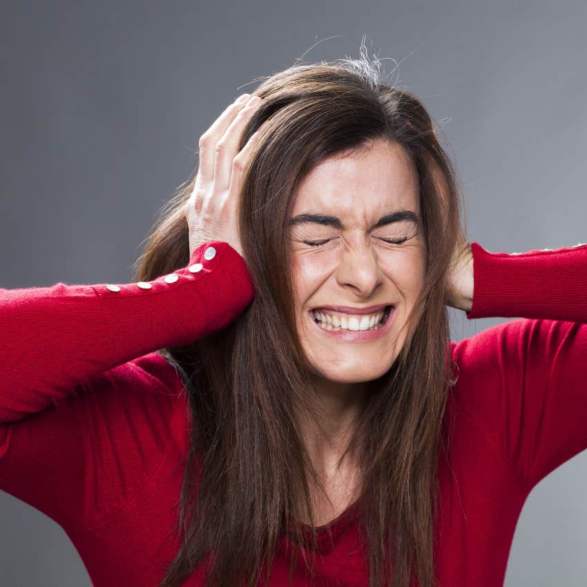 woman listening to certain sound and losing her mind