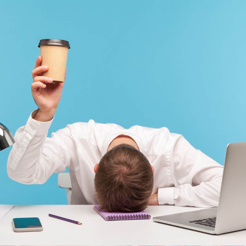 tired office worker drinking coffee in the afternoon