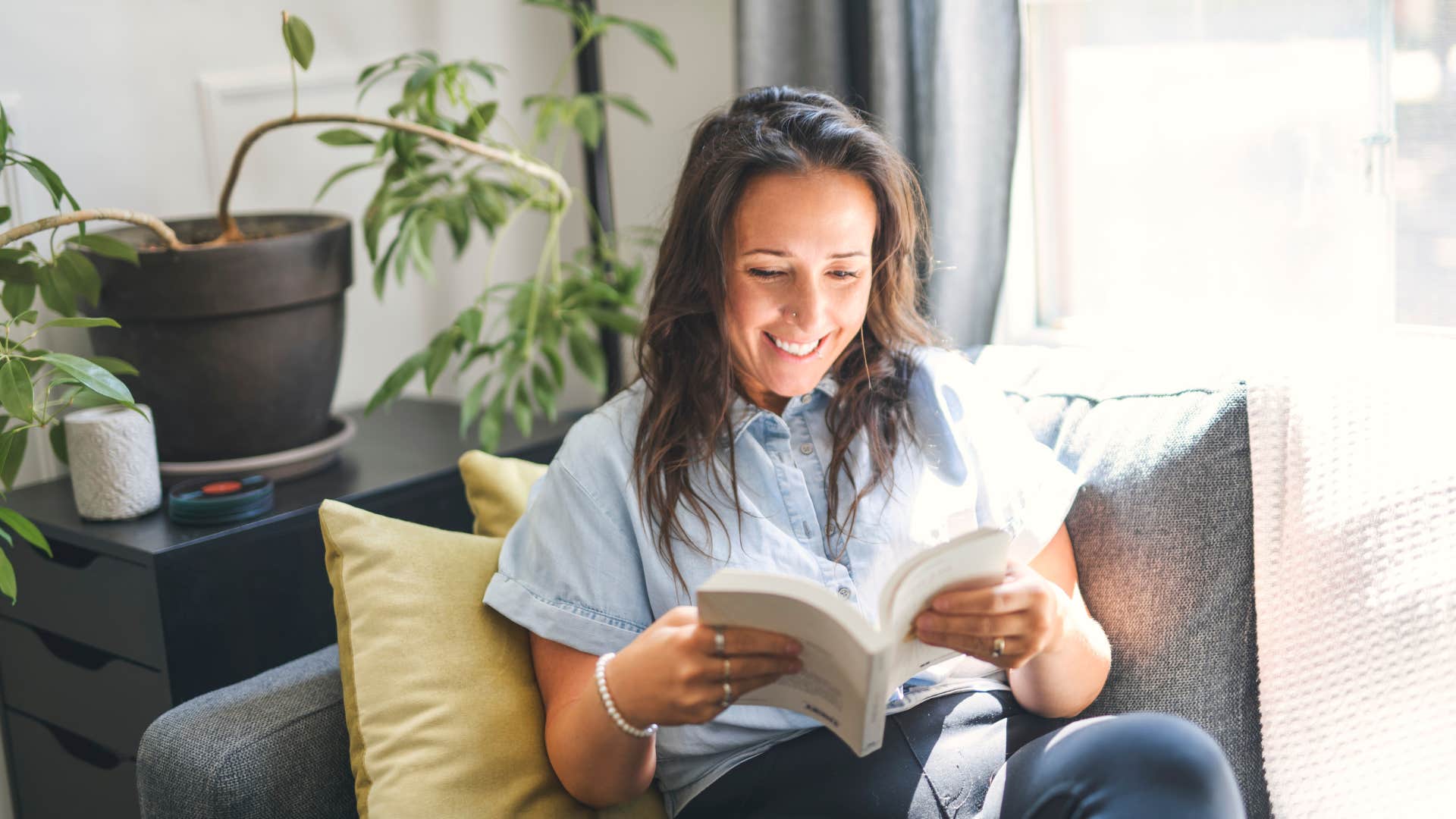 excited woman reading book to feel a sense of control