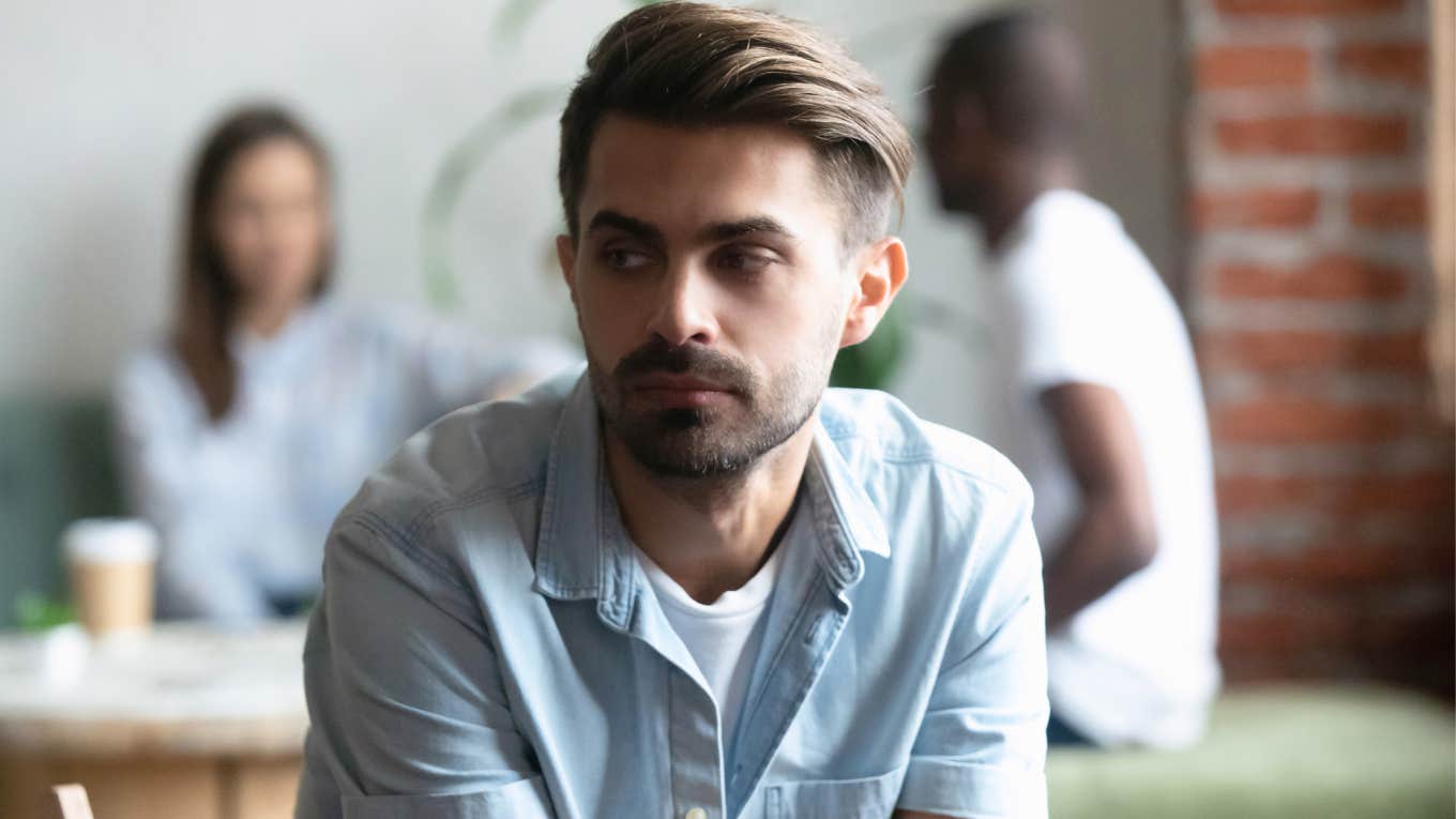 man feeling offended in social circle 