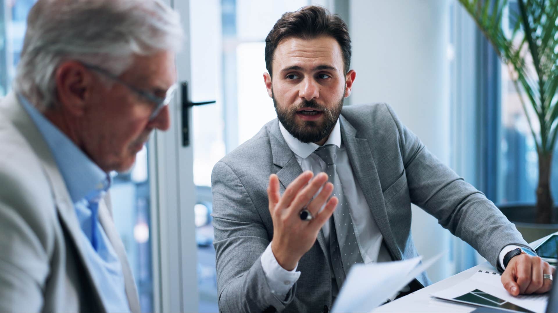 man saying obviously to his co-worker