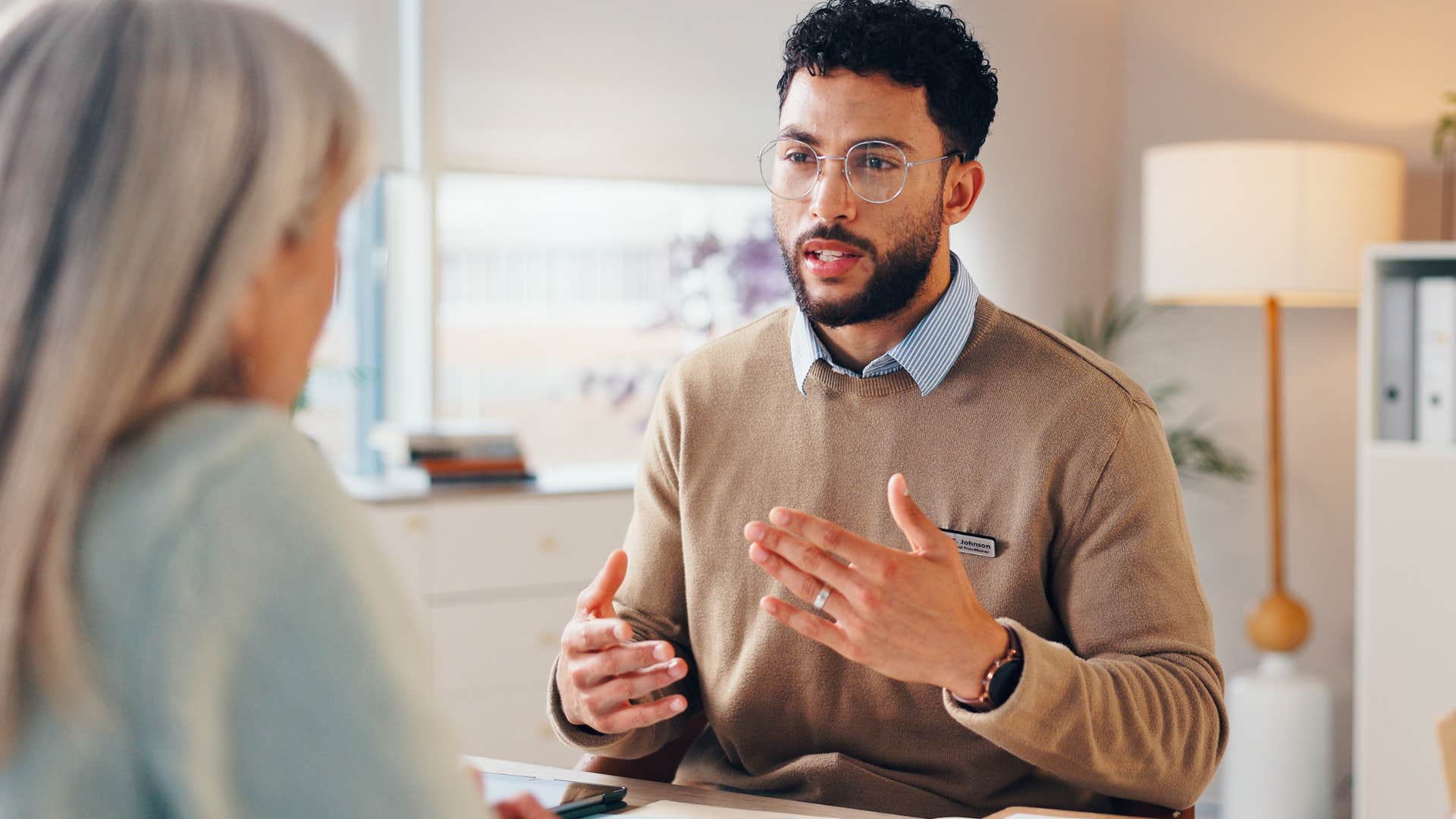 man telling colleague to touch base at work