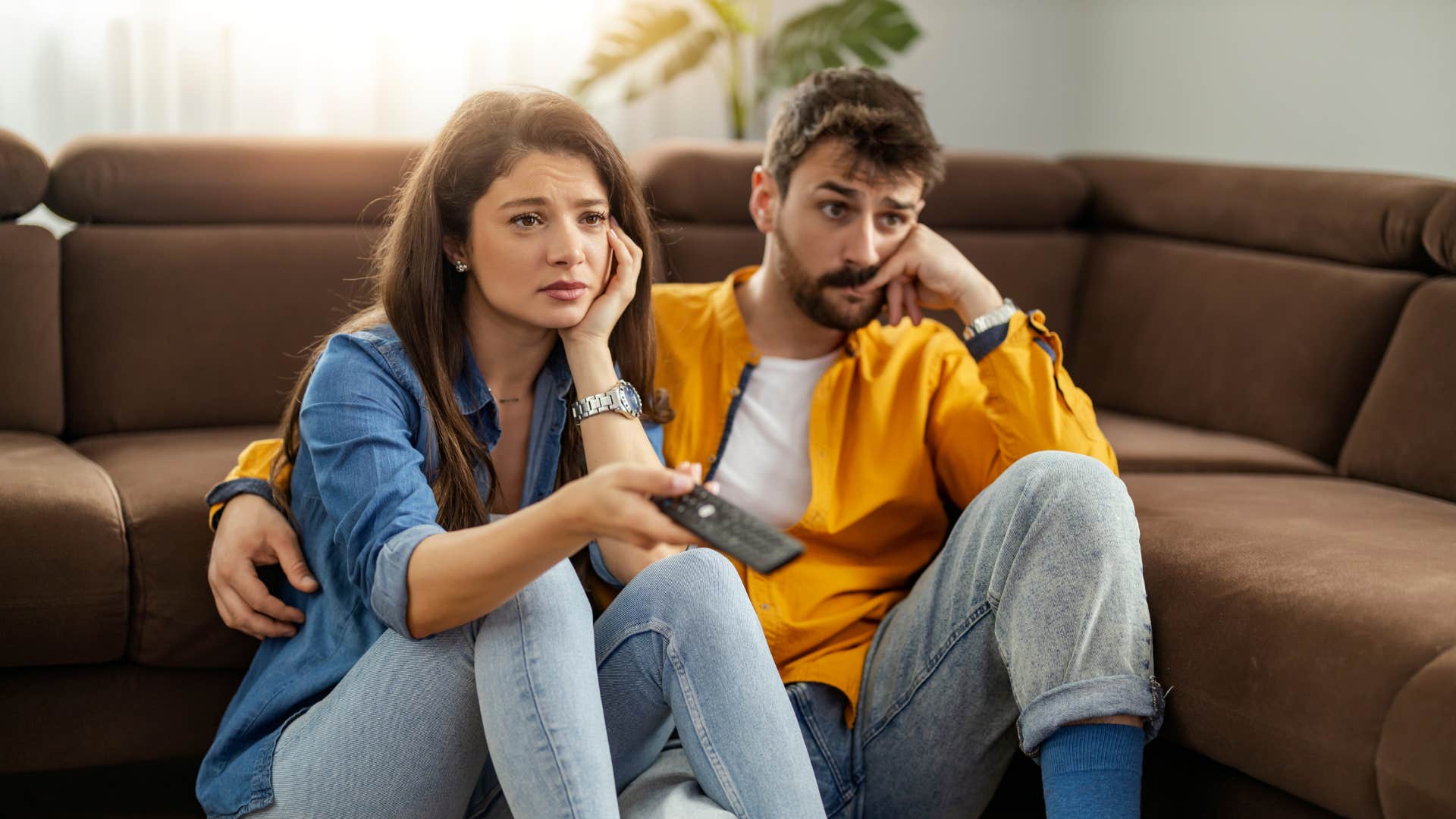 if a couple barely touches each other anymore, it usually means these things about their marriage things have become stale couple sitting on the floor looking bored as things have become stale