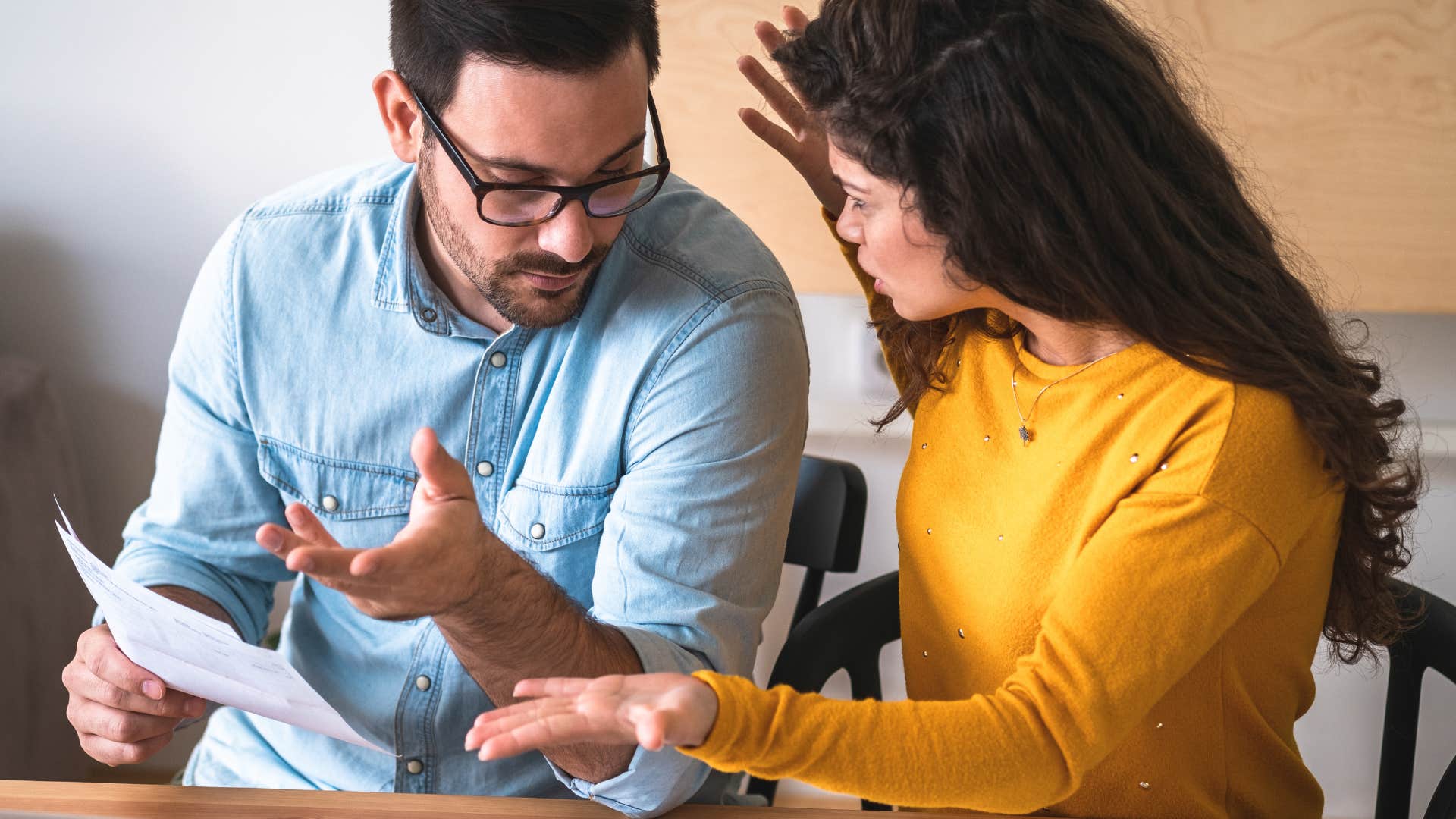 couple arguing about money and decisions surrounding major purchases