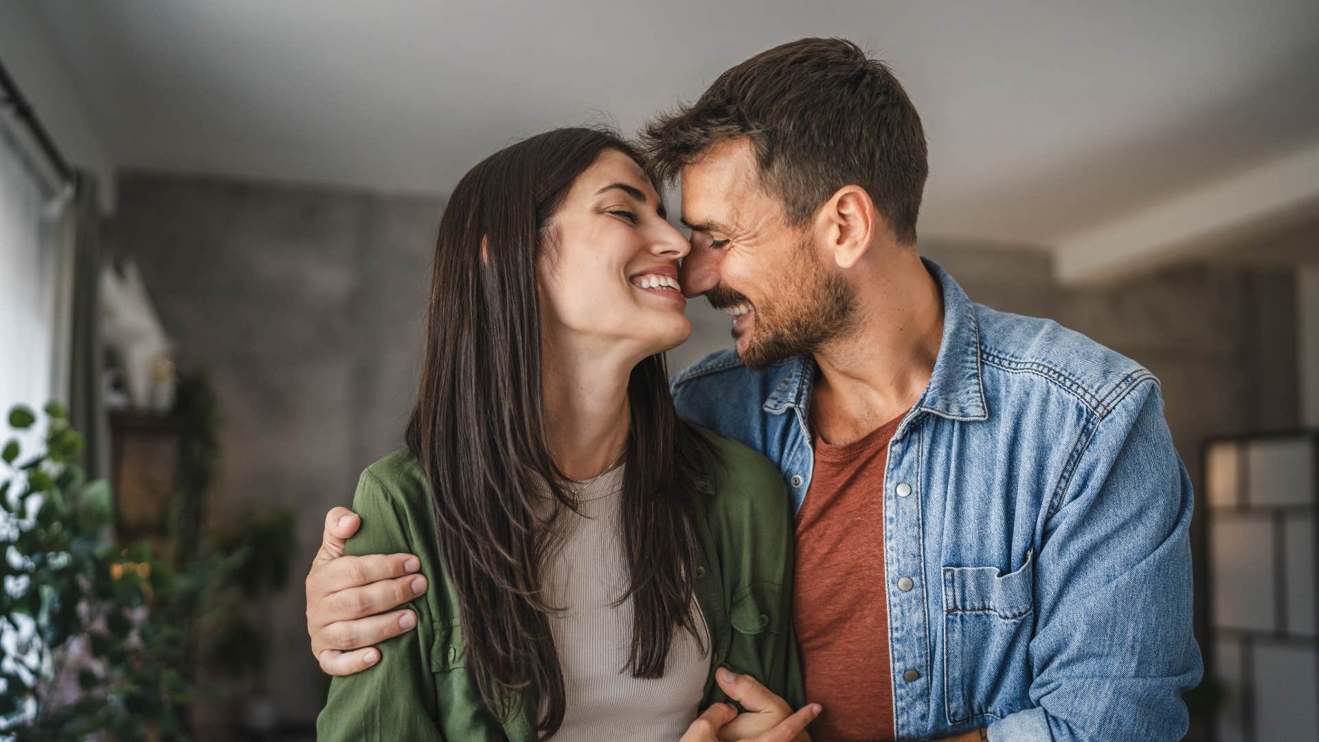 couple hugging each other smiling