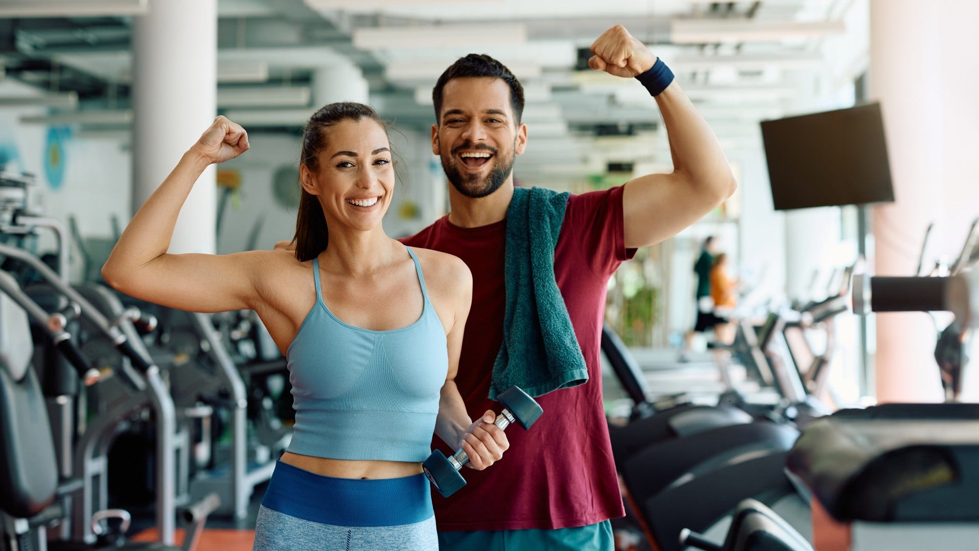 couple who are too tired to travel as they go to the gym together