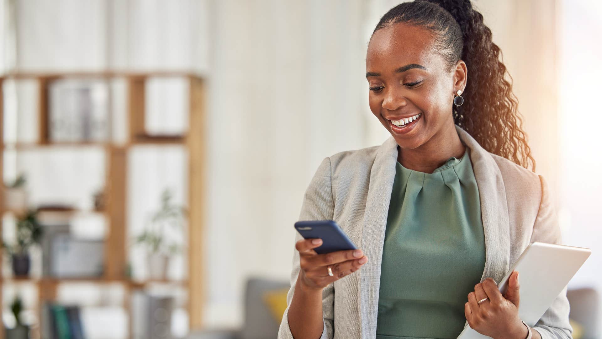 deeply in love people almost always send these text during casual conversation good morning I hope your day goes great smiling businesswoman sending good morning text to partner