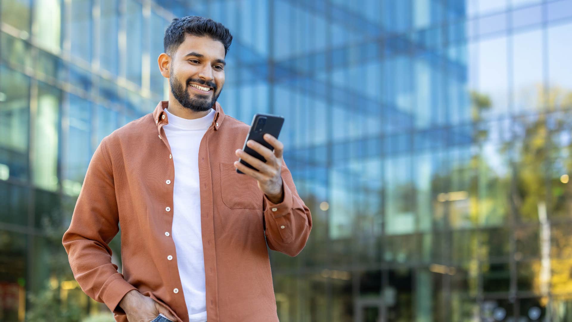 deeply in love people almost always send these text during casual conversation I hope you're having a good day smiling man sending good morning text to woman he loves