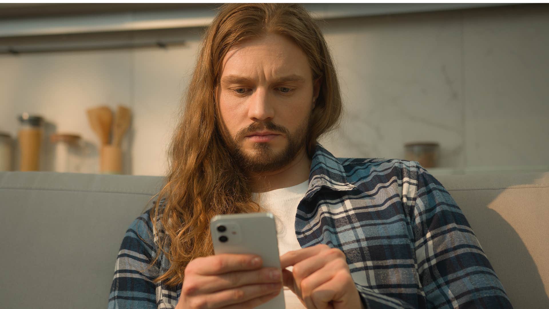 Man texting someone "fine" on his phone.