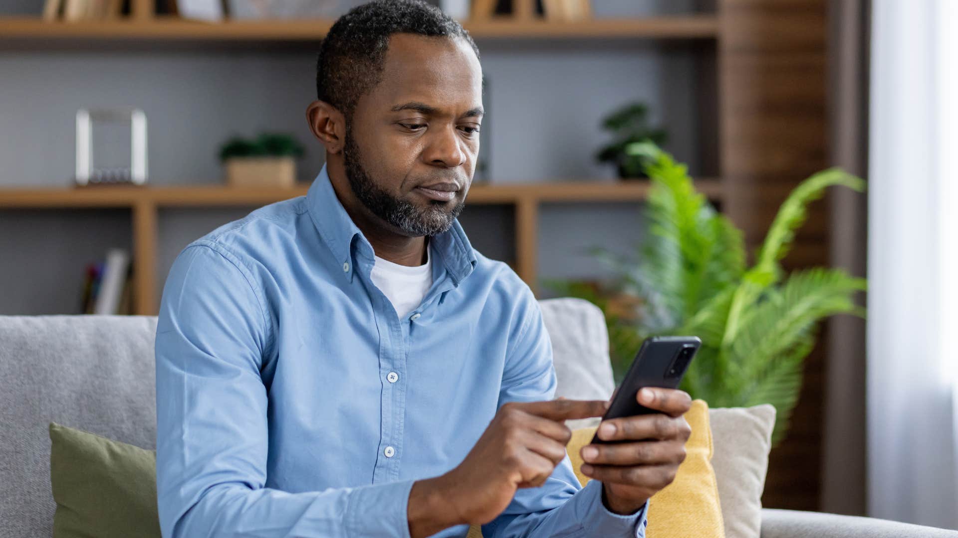 Man texting "good for you" on his phone.