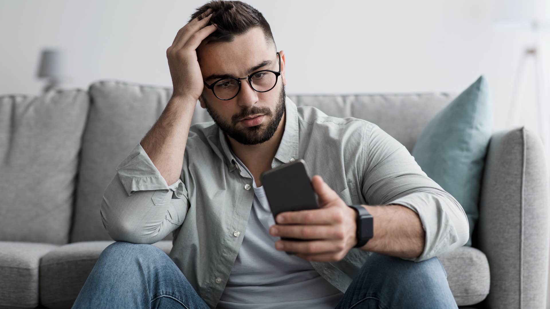 deeply unhappy man texting I miss when things were simpler