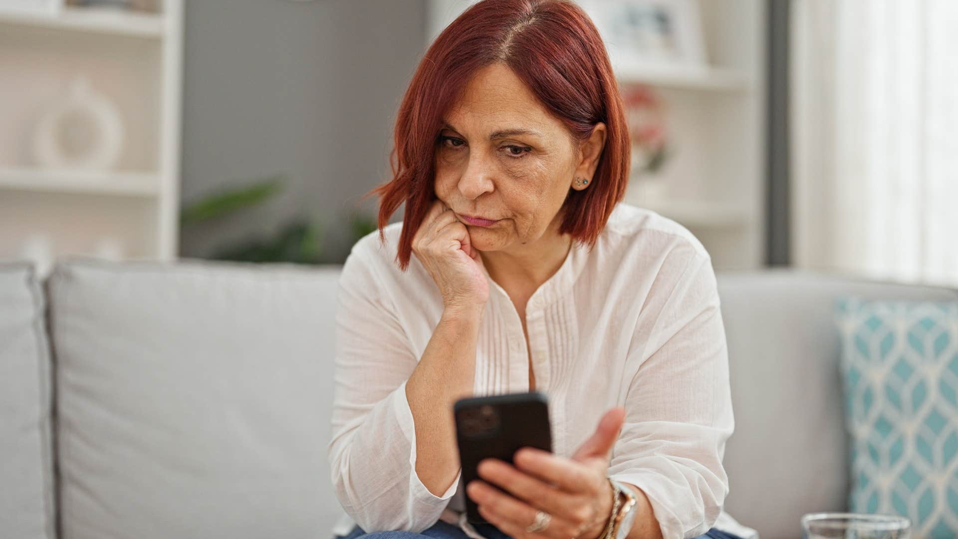 tired looking woman texting I'm just exhausted on her phone
