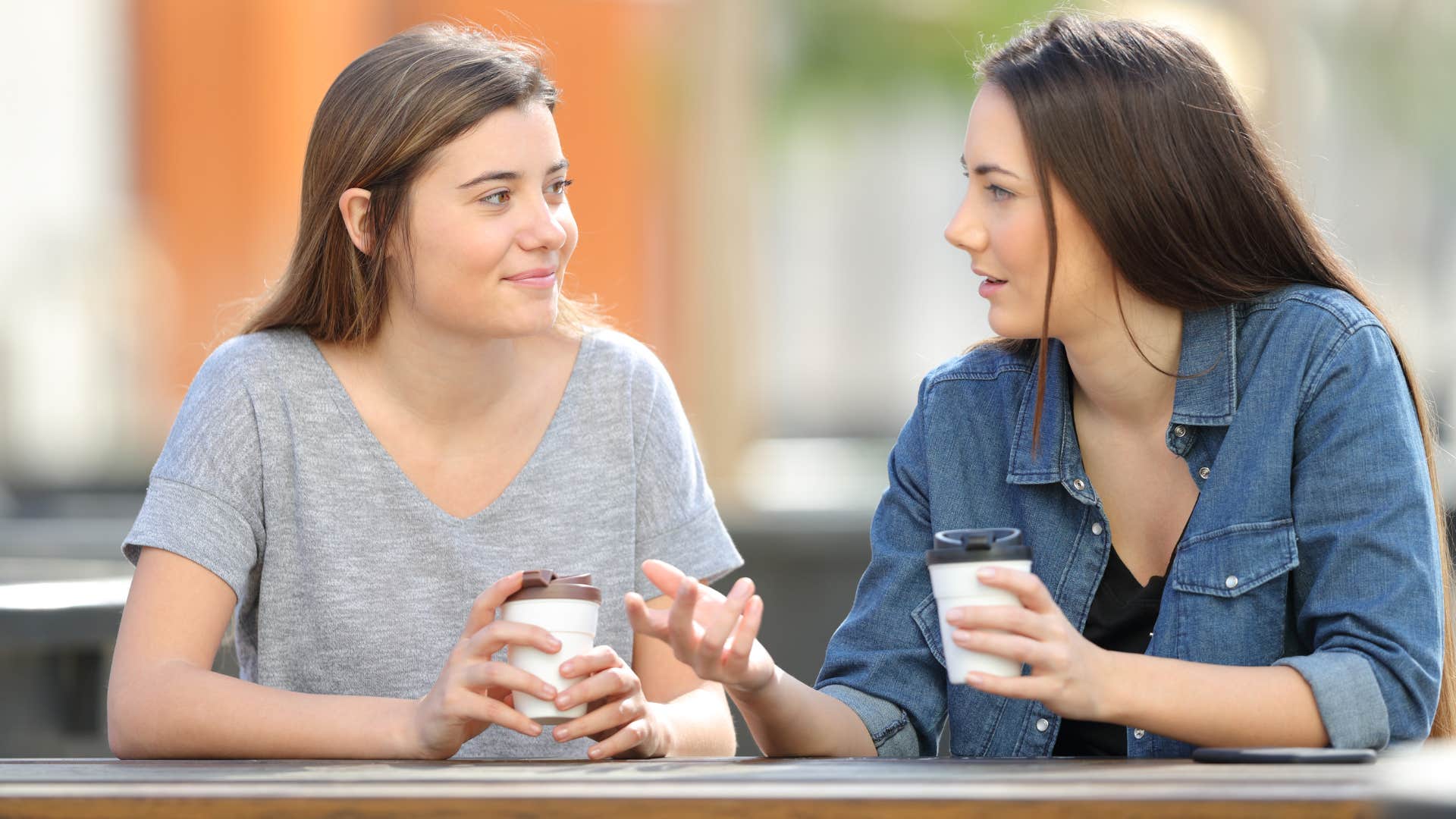 woman telling friend shes brave for wearing outfit
