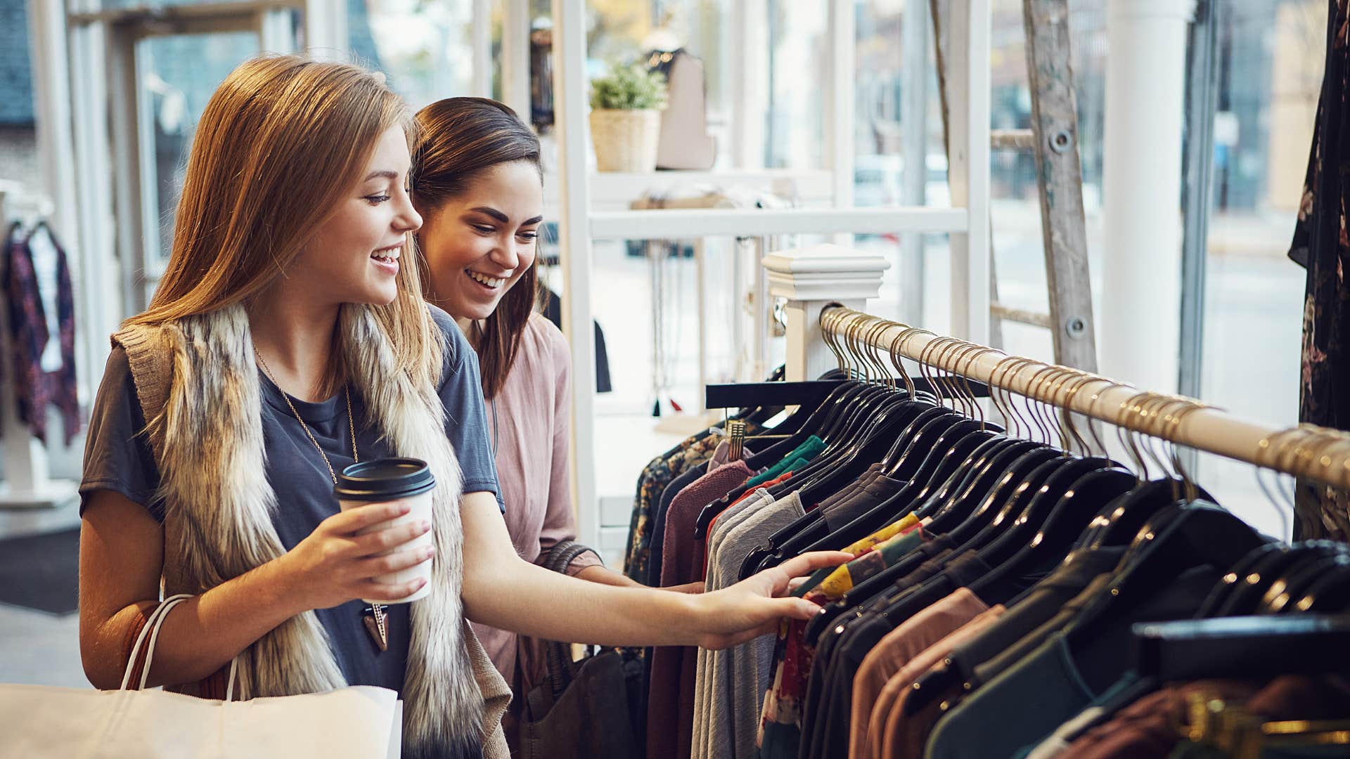 two friends shopping for clothes together