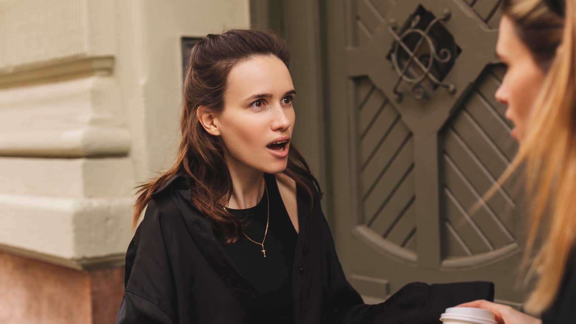 woman looking insulted after friend talked about her weight