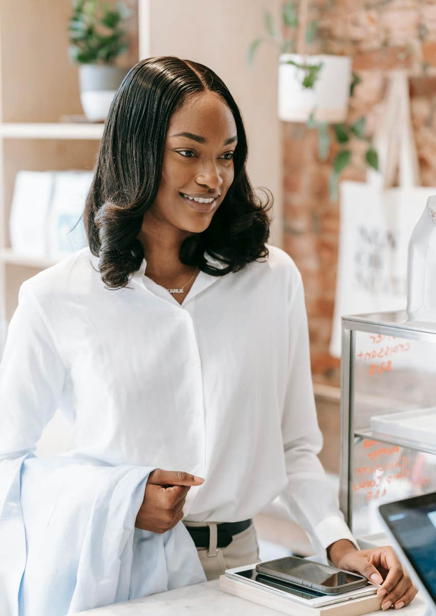 woman placing an order at a cash register