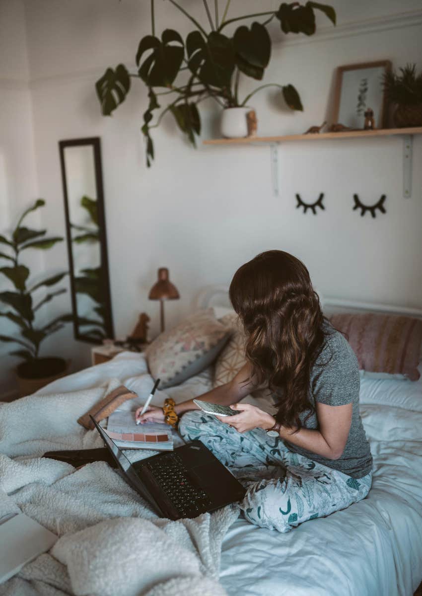 gen z woman in her bedroom at her parents' house