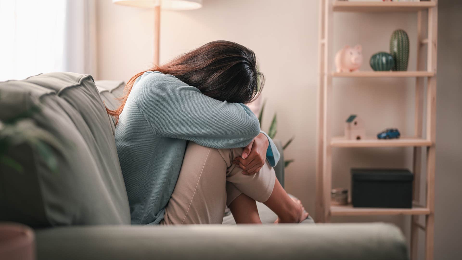 getting over someone you desperately loved feels impossible for these painfully honest reasons woman who is getting over someone and it hurts and there's no denying it