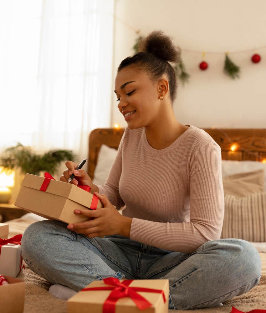 woman wrapping gifts for holidays