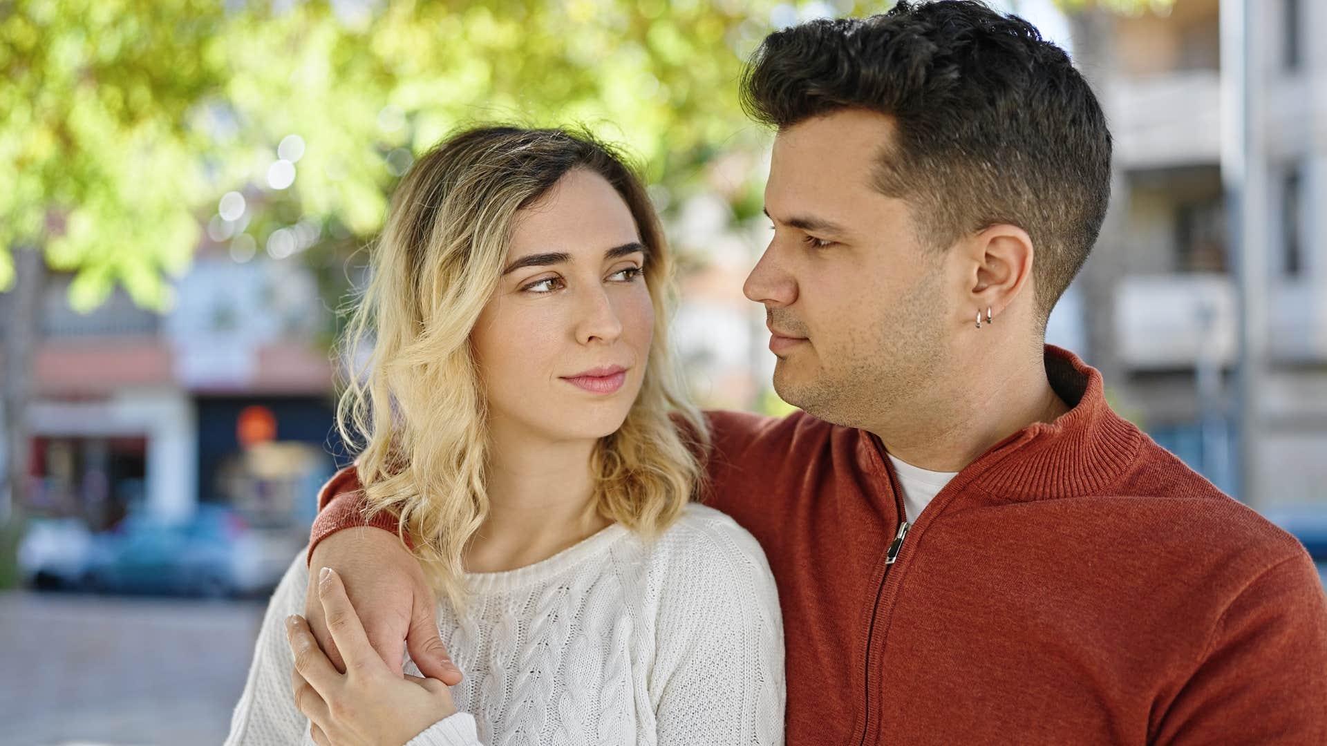 man who's acting fine looking at his wife in public