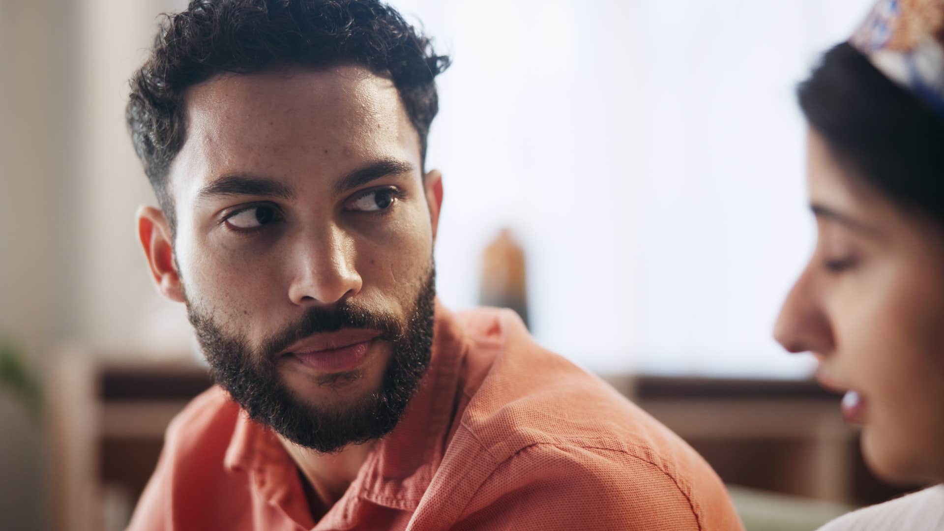 man looking at his wife and minimizing her feelings