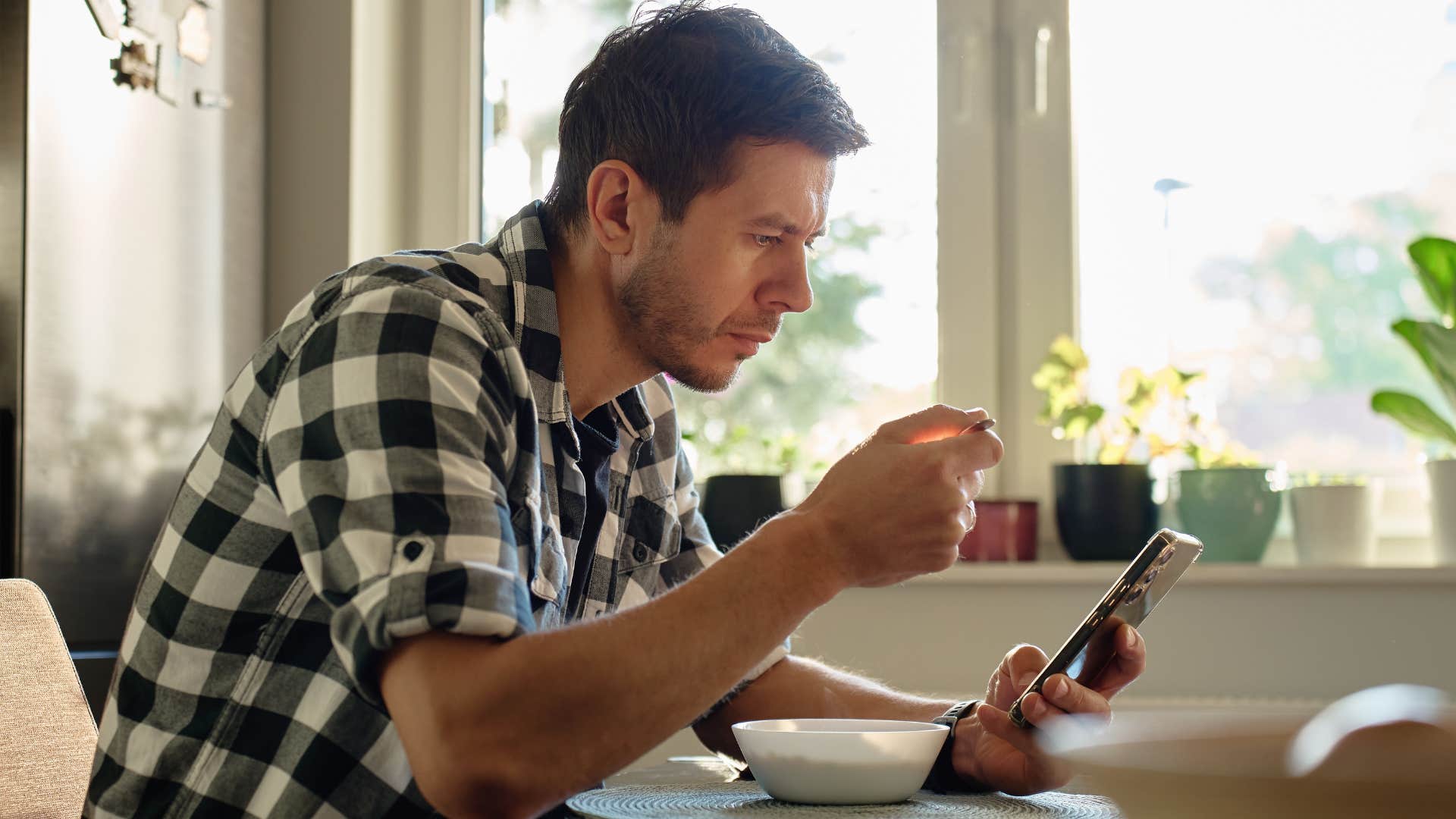 man spending too much time on his phone