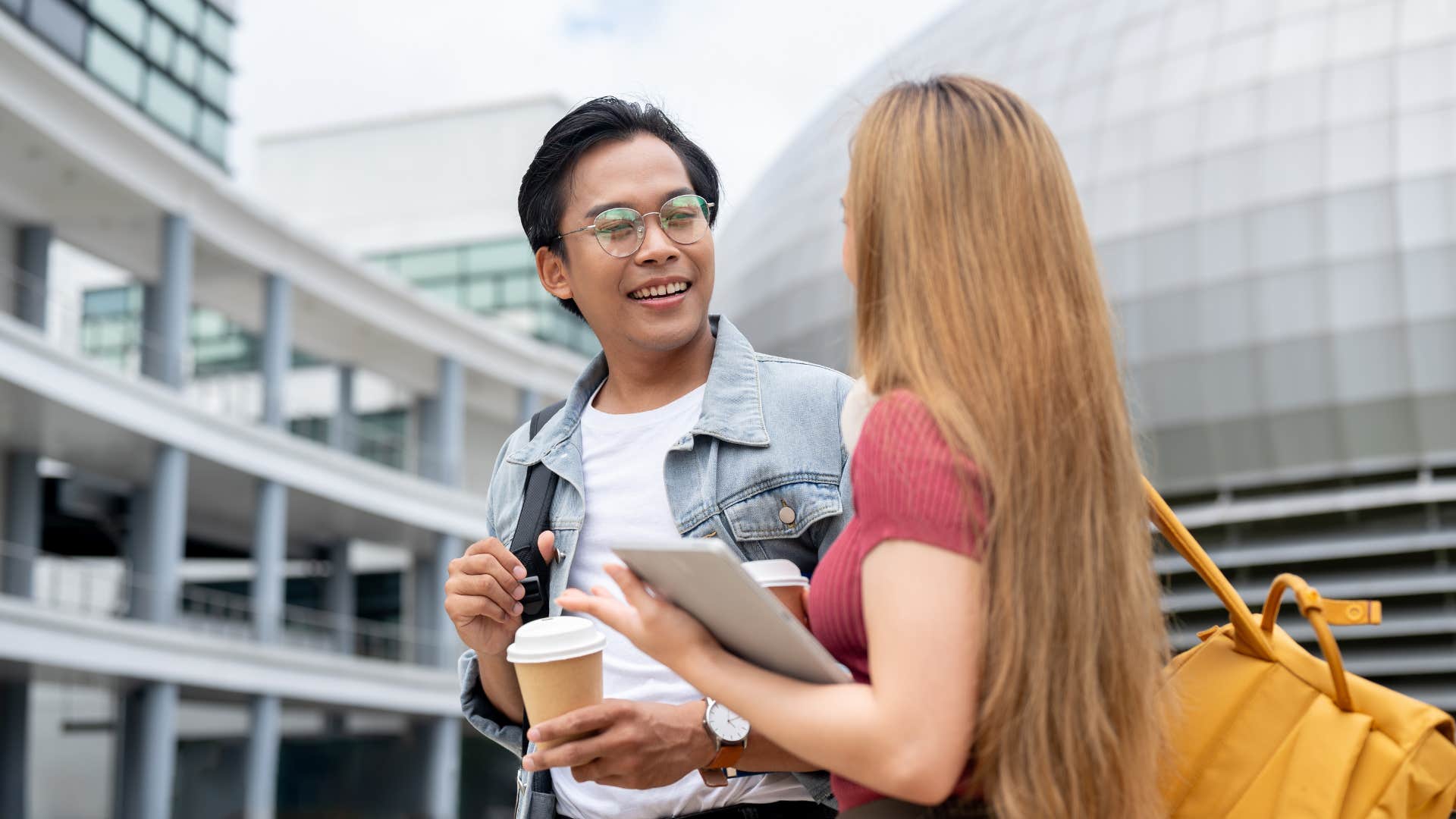 man in glasses listens more than he talks as he listens to woman in pink shirt
