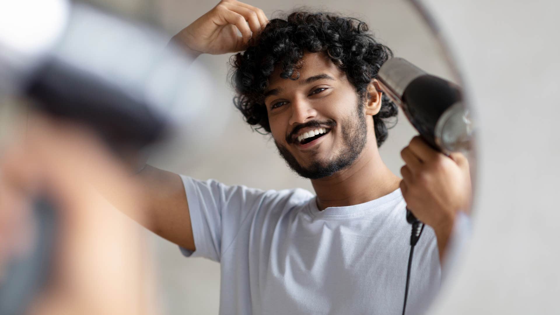 if you grew up broke but made it, you still probably can't bring yourself to buy these simple things professional haircut man giving himself a hairdo at home