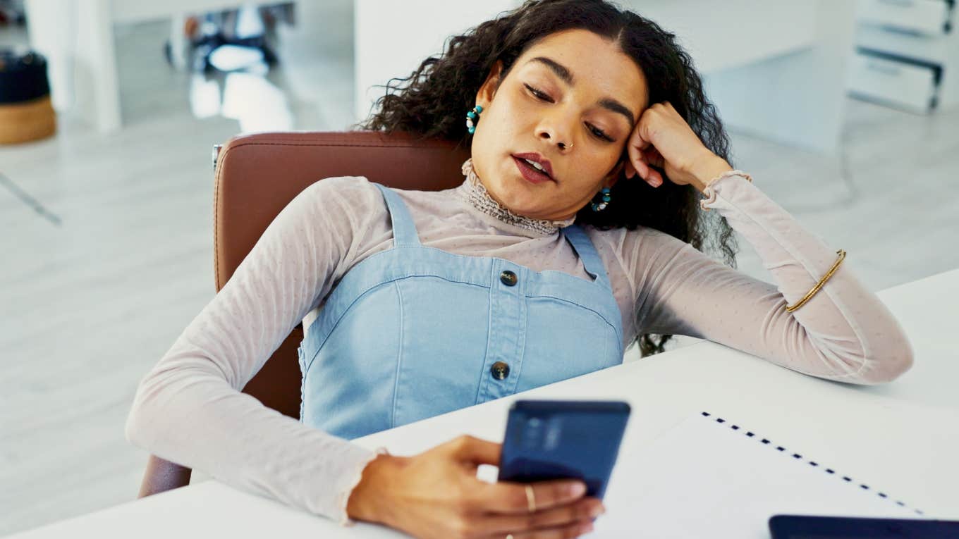 woman who hates talking on the phone looking at incoming call