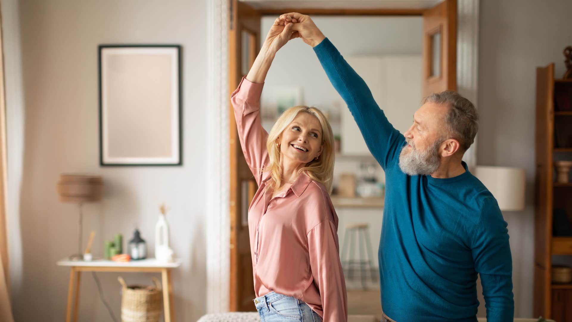 couple having fun dancing in the living room