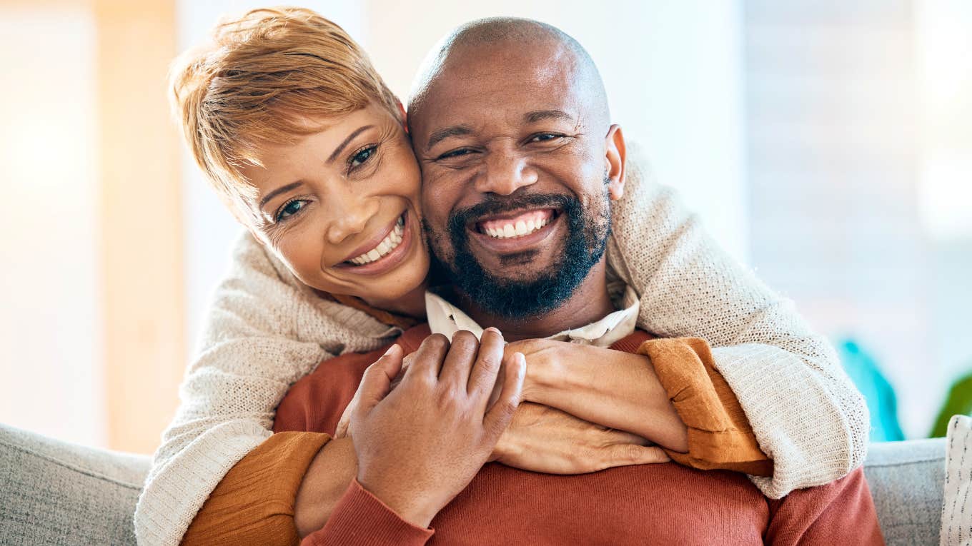 successful happy couple smiling together