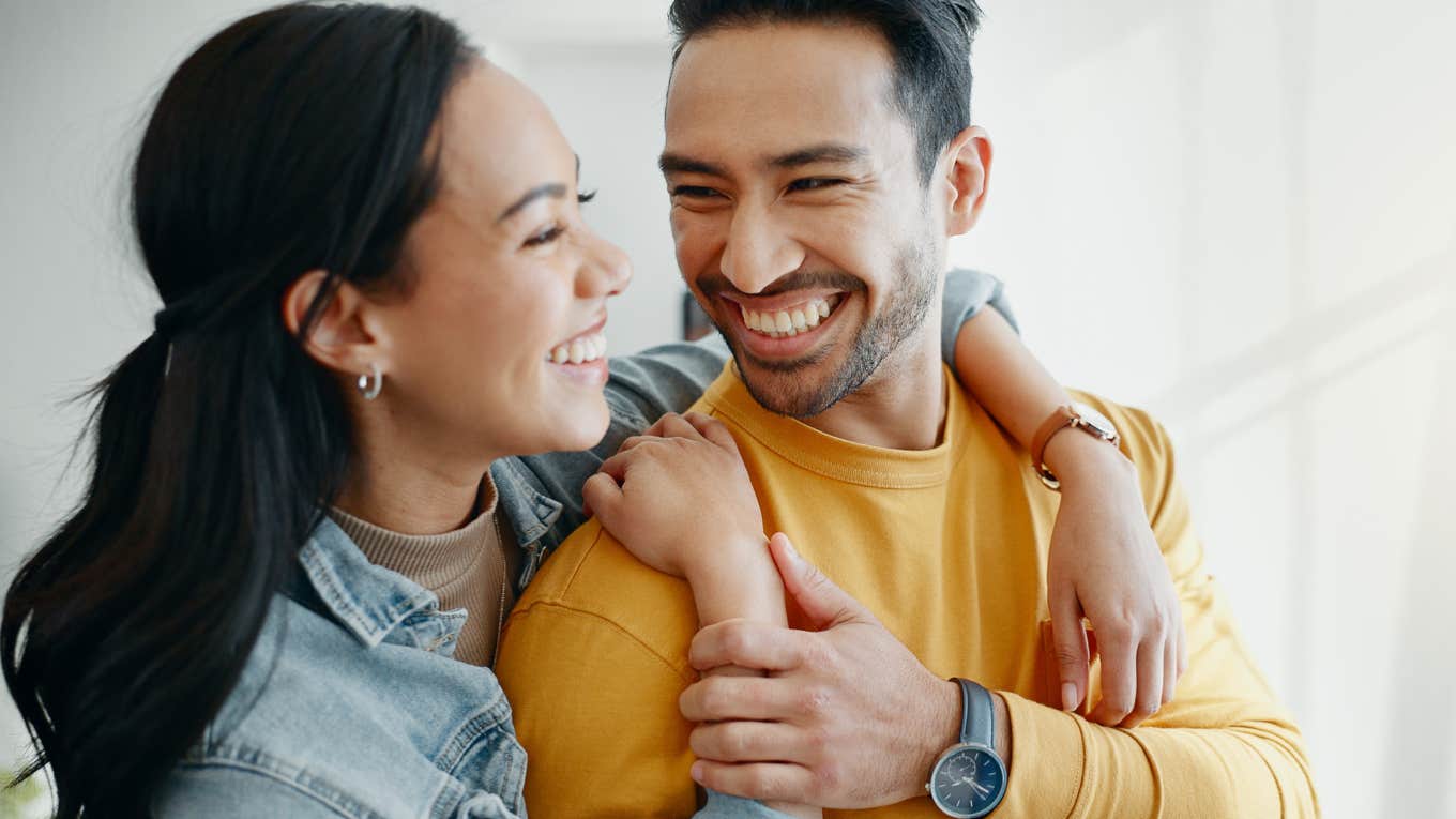 If A Husband Is Actually Happy In His Marriage, He'll Say These Phrases Casually happy husband looking at wife in healthy marriage