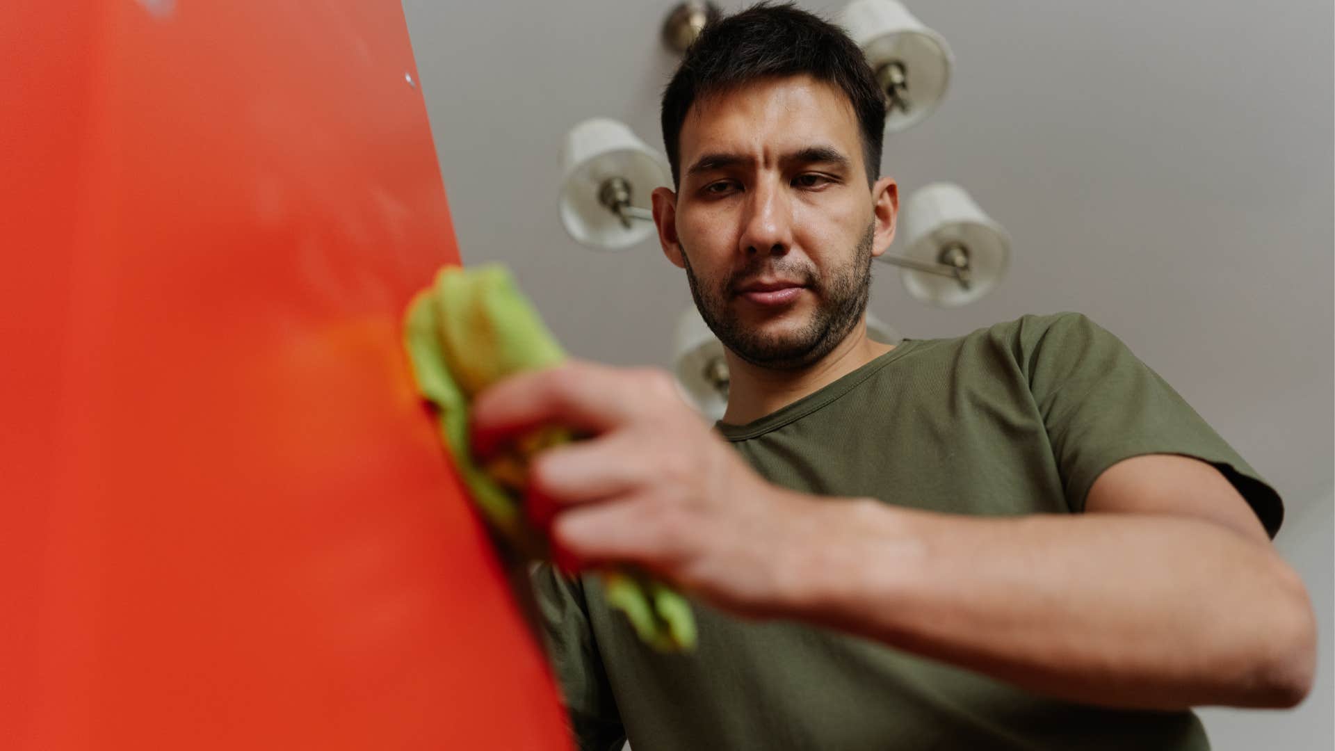 man doing the least favorite chores at home