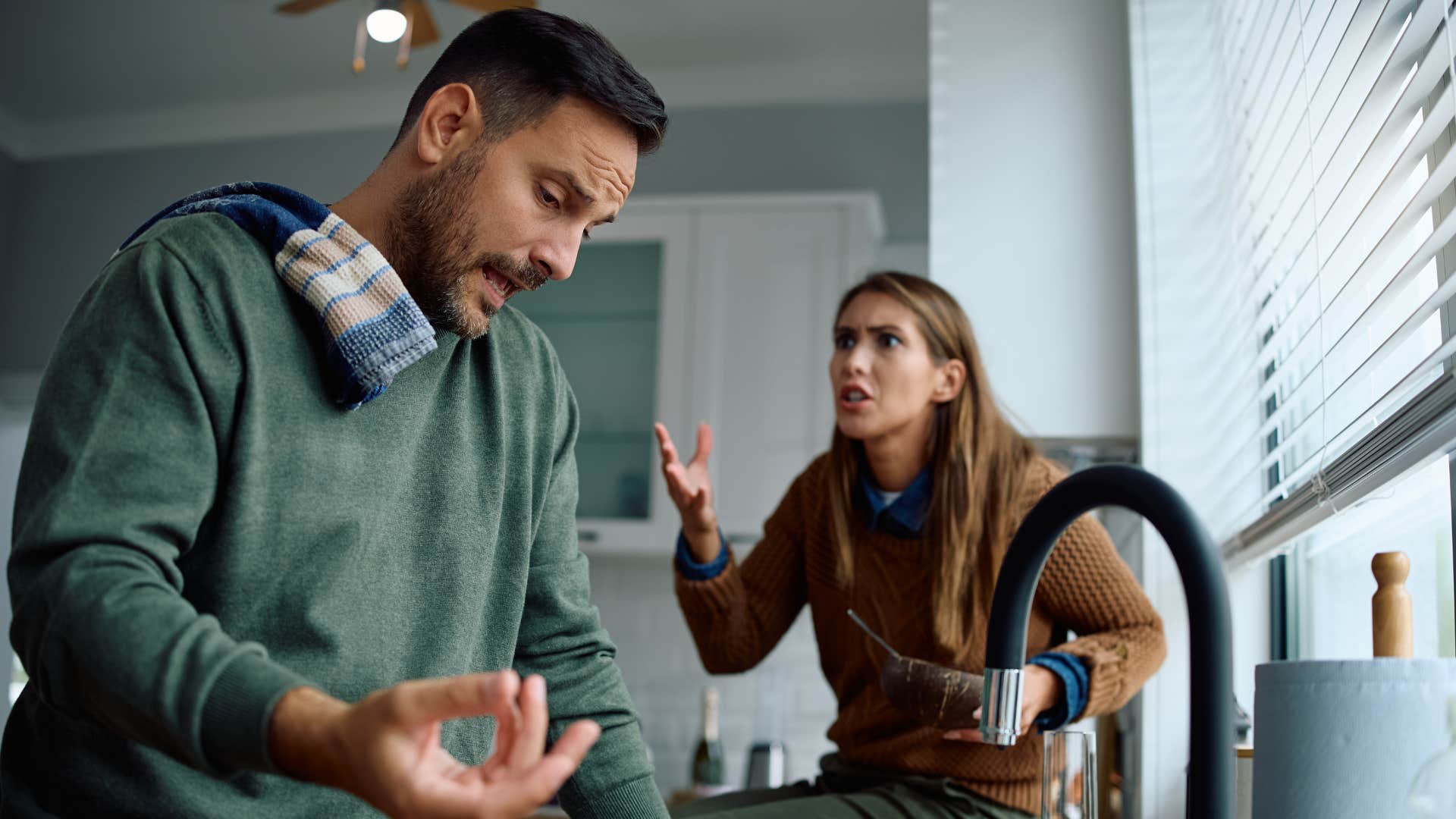 man not making coffee or breakfast arguing with his wife