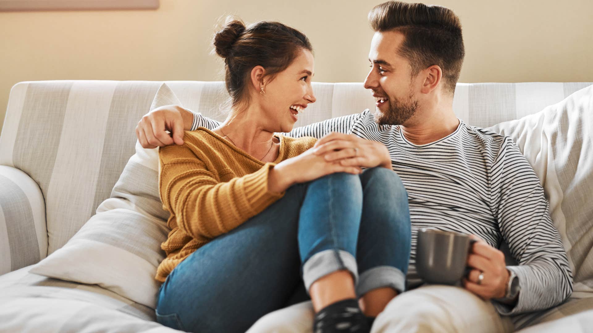 i miss you if a husband is actually happy in his marriage he'll say these phrases casually man saying i miss you to his wife sitting on couch